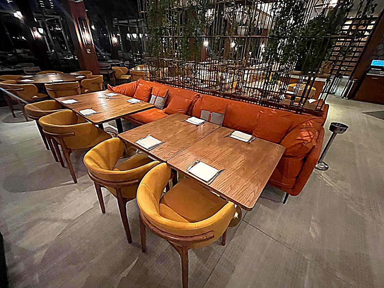 Hotel restaurant FF&E — leather banquette seating and upholstered dining chairs Dubai