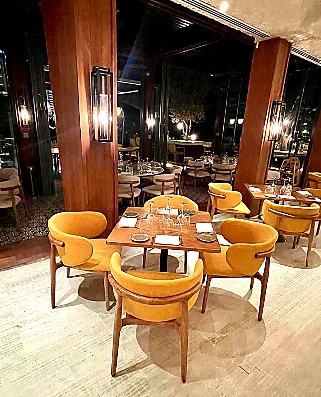 Hotel restaurant interior with upholstered lounge dining chairs