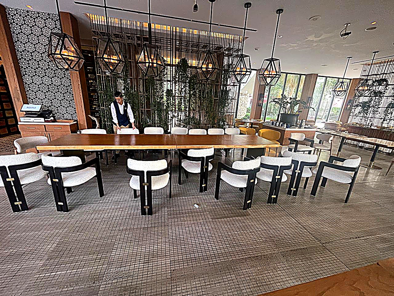 Hotel restaurant bespoke dining chairs and long communal table, contract FF&E supply Dubai
