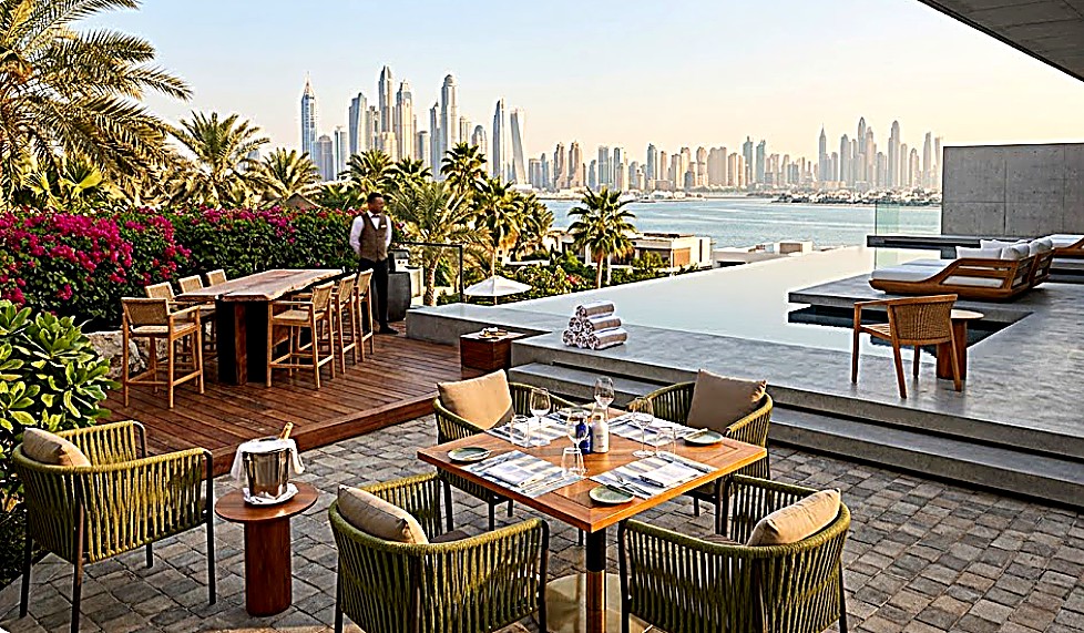 Rooftop hotel terrace dining furniture with Dubai skyline, hospitality FF&E supplier
