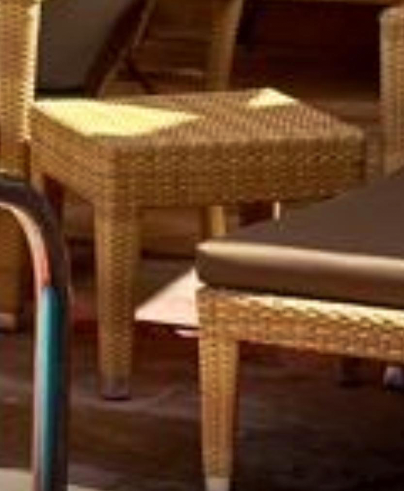 Custom woven side table detail beside a poolside sunlounger, five-star resort, Abu Dhabi